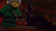 Garmadon throws the picture onto the floor.