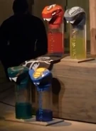 Jars of an unknown liquid seen in The Realm of Shadows, with a recreation of Slithraa's head used as one of the bottle caps.