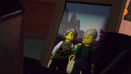 Garmadon, looking at a picture of himself, in human form with Lloyd.