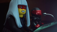 Mr. E and Harumi, monitoring Lloyd and Garmadon’s battle.