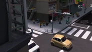 Vlad Tutu in Ninjago City talking to someone on the steps of a building.