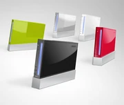 Five Wii consoles in white, red, black, and light green.