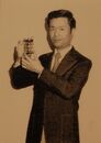 Gunpei Yokoi holding the product.