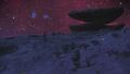 The desert at night with one of the many geological formations.