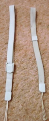 New strap (left) next to original strap design.