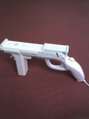 Wii Zapper with Wii Remote and Nunchuk.