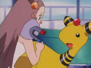 Jasmine takes care of the Glitter Lighthouse Ampharos.