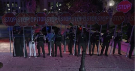AJ and other cops lined up out front of the courthouse to protest The Canceller