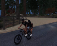 Cassie and Ventura ride a bike through the Paleto forest for her birthday on October 2, 2025.