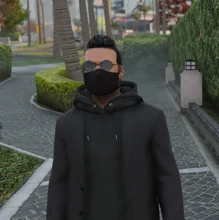 Michael Razzel in his typical suit and hoodie fit.