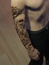 Old Left Arm Tattoo