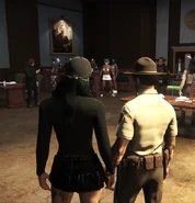 Cassie supporting Ventura during one of his court cases at City Hall.