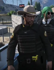 Interim Warden Bard and Suki Cruz his Girlfriend.