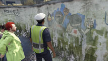 Jordan shows Chips the mural of his Middle Eastern friends