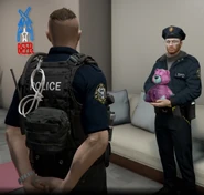 Dark holding a teddy bear