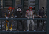 Ember Quinn, Sneaky, Wendy Thomas, and Marley dance in front of The Funhouse.