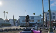 Cassie, then having officially joined Hades as a hangaround, stands on a car in her new turf in Vespucci.