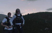 Claire and Alex in a cop uniform