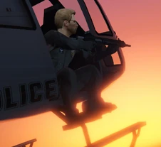 Frank shooting out of a helicopter