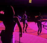 Naomi performing for Liz and Carmella