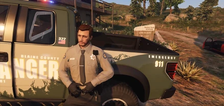 Conan standing next to a Park Ranger Truck