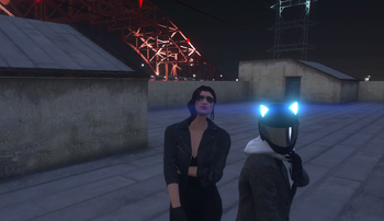 Gigi leans with Yuno during a Friday crew meeting January 26, 2024
