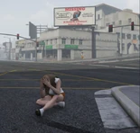 Adora in front of Jake's Billboard