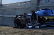 Cassie and Ventura sit and talk after she finishes repairing his car at MRPD.