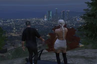 Edbert smoking with Fiona on top of a mountain