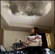 Ellen looking up at the cloud in her room.