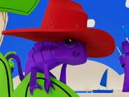 Purple, wearing a hat