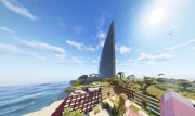 A screenshot from the game Minecraft showing a large cobblestone wall extending to the build limit. The wall is made entirely of cobblestone blocks and reaches up to the sky, demonstrating the scale of the vandalism. The surrounding area includes grass and trees, with the wall casting a significant shadow over the landscape.