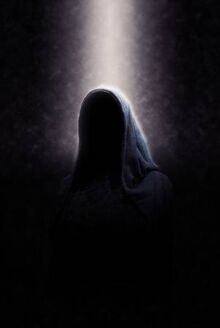 38437454-eerie-image-of-creepy-dimly-lit-faceless-cloaked-figure-in-spotlight-on-dark-background