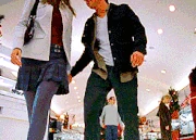  walking through the mall together doing some Christmas shopping