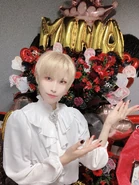 Mina crossdressing during her birthday event.