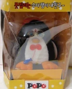 a black and white Popo in its box