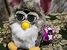 a Church Mouse Furby with a Furby tag