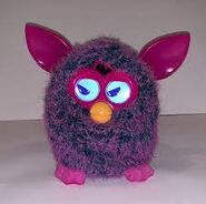 A Voodoo Furby with the grumpy personality