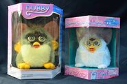 A Dubby and a Furby Baby in their boxes.