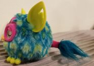 A side view of a Peacock Furbling (photo by @moddad on Tumblr)