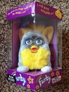 A boxed Banana Peel Furby