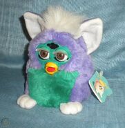A Very Purple Furby Baby with brown eyes