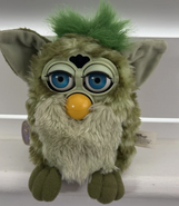 Alligator Furby with neon blue eyes