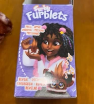 Descarga (1).png (667 KB) Side of its box showing the functions of the Furblets