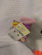 A picture of a Baby Loobie with two tags