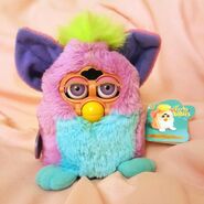A sunbleached faceplate on a Spring Furby Baby