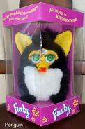 A NIB spanish Penguin Furby (neon green eyes)