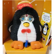 a black and white Popo attached to its cardboard packaging