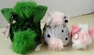 The back of an adult Furby, a Furby Buddy, and a Hair Baby