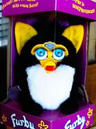 A NIB spanish Penguin Furby (neon blue eyes)